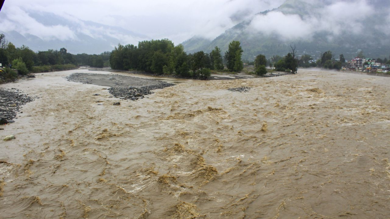 Beas river flows in spate after heavy rainfall, in Kullu, Sunday. 