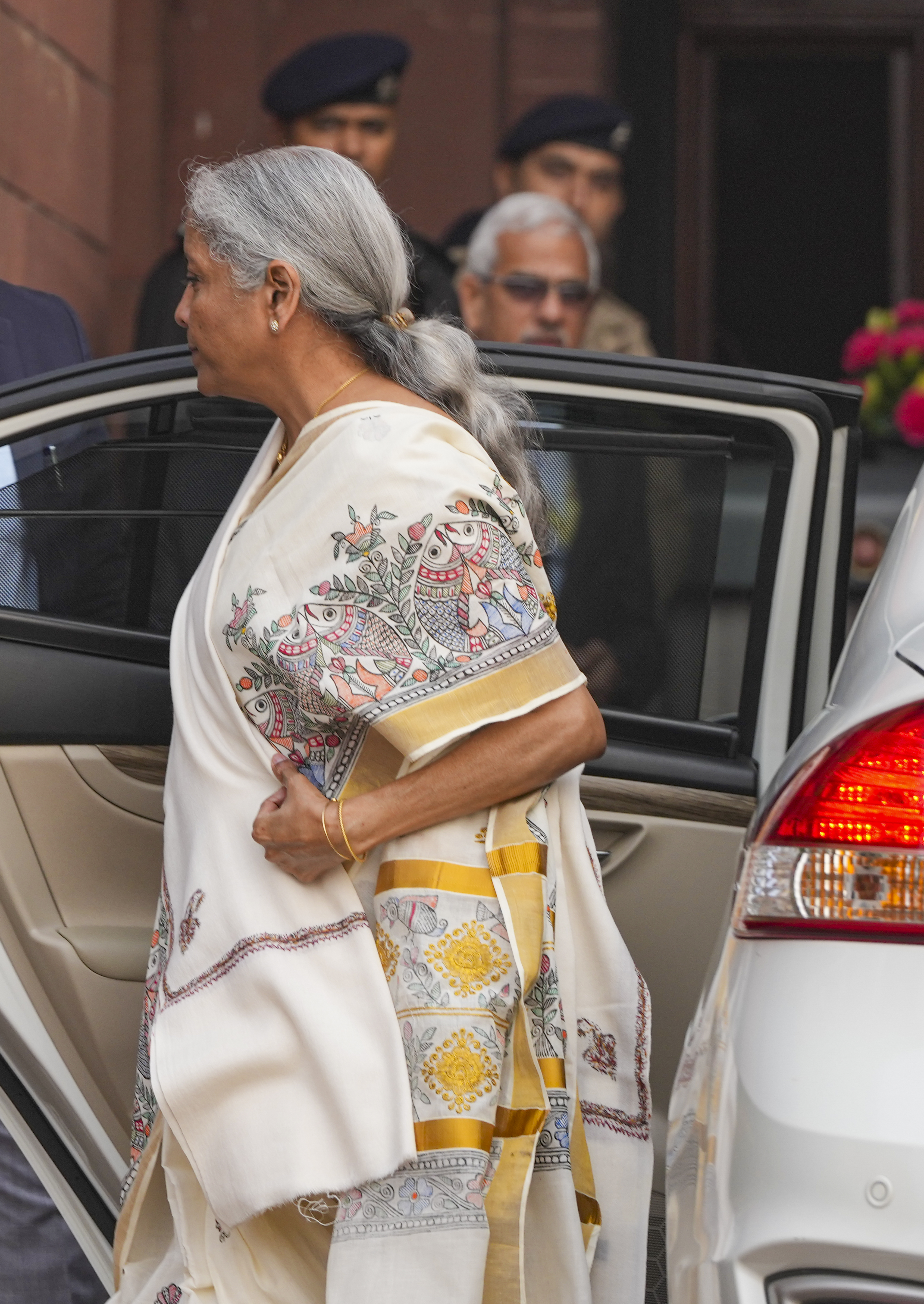 Sitharaman paired the saree with a red blouse and a white shawl.