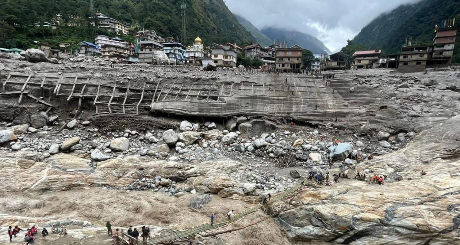 emporary bamboo bridge being set up at Chungthang, where the Teesta III dam was swept away.